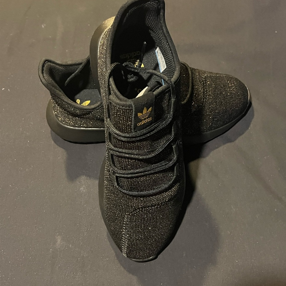Adidas black and gold thread sneakers